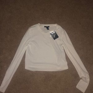 White long sleeve w/ buttons on the sleeve